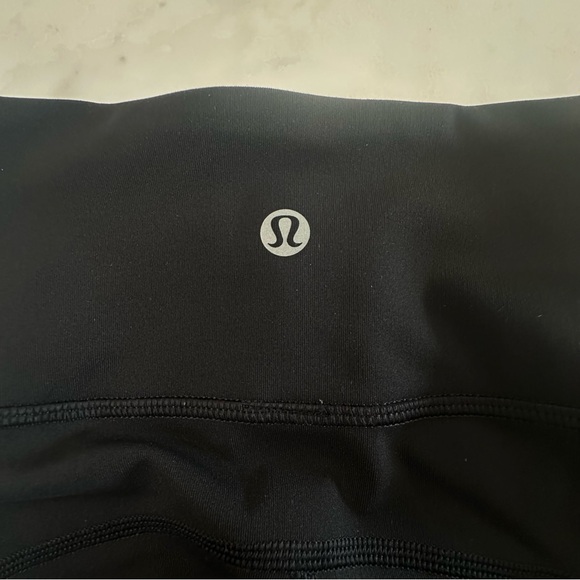 Lululemon Black “Tied to it” High Rise Leggings with mesh/tied ankle detail. - Picture 2 of 13